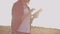 Close-up of a woman at sunset touches the wheat germ and makes the data in the tablet