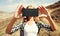 Close-up woman taking selfie picture by smartphone on a hiking trail on top of the mountain, Tenerife, Canary Islands