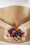 Close Up Of Woman In Underwear Holding Fresh Summer Berries