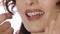 Close up of woman using dental floss