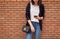 Close-up of woman using smartphone with typing an sms message to friends and walking in mall.