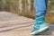 Close up woman walk in to the wild. Travel adventure and freedom concept.Woman walking outdoors, shoes closeup