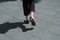 Close-up of a woman walking on the street with fashion socks