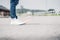 Close up woman wear jean and white sneaker standing on highway r