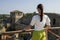 Close-up woman in a white blouse background of the defensive stone walls.