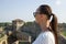 Close-up woman in a white blouse background of the defensive stone walls.