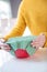 Close Up Of Woman Wrapping Food Bowl In Reusable Environmentally Friendly Beeswax Wrap