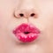 Close up of womans pouting lips with lipstick