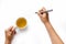 Close up of women arm writing with metallic pen. on white background Hand Holding a pen on white background