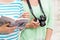 Close up of women with city guide and camera