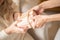 Close-up of women` hands holding a gift box