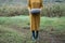 close up of women hands holding grey pumpkin in nature. Halloween or Thanksgiving concept