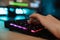 Close up of a women`s hand typing on a gamer