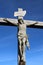 Close-up of wood cross with figure of Christ outdoors