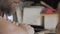 Close-up. a woodcarver processes a walnut wood board with a chisel. craftsman makes a tea tray