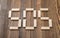 Close-up wooden bricks making form of words SOS