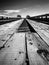 Close up of a wooden bridge in black and white.