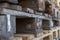 Close up of wooden cargo pallets overlap in warehouse. Selectiive focus