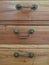 Close up of wooden chest of drawers