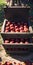 a close up of a wooden crate filled with red apples