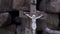 Close up for the wooden cross with crucified Jesus on stone bricks background, Bible and religion concept. Footage