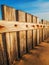 Close up of wooden fence in sand