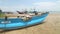 Close up of wooden fishing boats and nets on beach in Weligama, Sri Lanka.