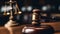 Close up of a wooden gavel in a courtroom with the scales of justice blurred in the background, symbolizing law, order, and