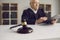 Close-up of a wooden gavel placed on sound block on judge's table in courtroom during court hearing.