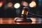 Close Up of Wooden Judge Gavel on Blurred Background
