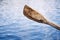 Close-up of wooden paddle over soft water