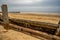 Close up of wooden sea defences on a sandy beach