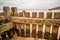 Close up of wooden sea defences on a sandy beach on the North Norfolk coast