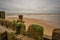 Close up of wooden sea defences with an soft and out of focus background