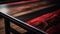 a close up of a wooden table with red and black stripes