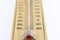 Close-up wooden thermometer scale isolated white background.