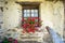 Close-up of the wooden window of an old mountain chalet, Aosta Valley. Italy