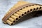 Close-up of woodwind instrument pan flute. Details of musical instruments, music