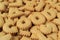 Close-up of the word GOOD spelled with alphabet shaped biscuits on the pile of same biscuits