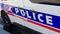 Close up of the word `Police` written on the side of a French National Police patrol vehicle