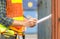 Close up of Worker man holding clipboard checklist and checking containers box from cargo