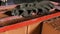 Close up of a worker putting mortar into the wooden frame to make a layer on the brick wall. Stock footage. Levelling of