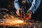 Close-up of workers hands welding metal parts with sparks flying in detailed focus