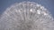 Close-up of a working globe shaped fountain on the blue sky background in slow motion