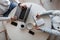 Close-up of the working process at a business meeting of two managers. Top view on a desktop with a laptop with a notepad