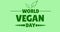 Close-up of world vegan day symbol text on green background