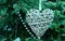 Close-up. woven heart at Green tree