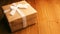 Close-up of wrapped gift box on wooden table