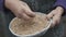 Close up of wrinkled old woman`s hands stirring the grains of wheat 4K