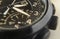 Close up wrist watch, chronograph, chronometer, analog, close up hour and minute hand, black background, close up watch